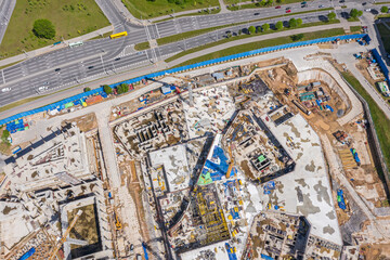 Fototapeta premium aerial image of a large commercial building during early stage of construction. modern buildings under construction