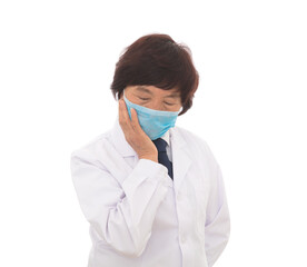 Tired female doctor wearing a mask in front of white background