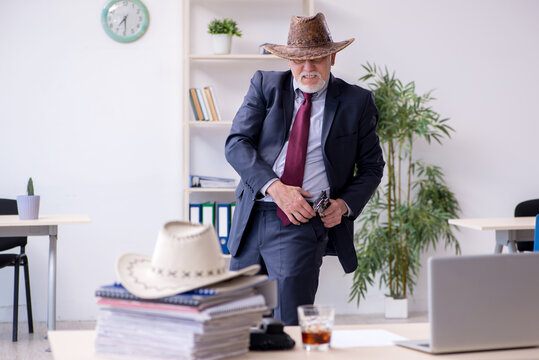 Funny Old Boss In Cowboy Hat In The Office