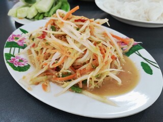 Thai food, papaya salad in the dish.