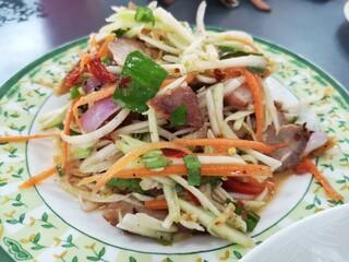 Thai food, papaya salad in the dish.