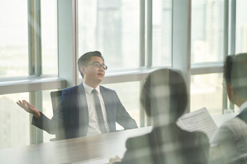 arrogant asian job candidate being interviewed by HR team