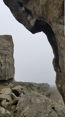 rock formation in misty sky background