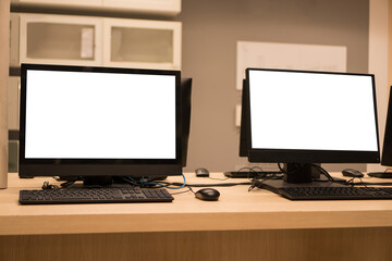 E-learning study concept: Mockup of monitor computer pc for business training computers using or typing on pc with blank white screen in information technology center at university