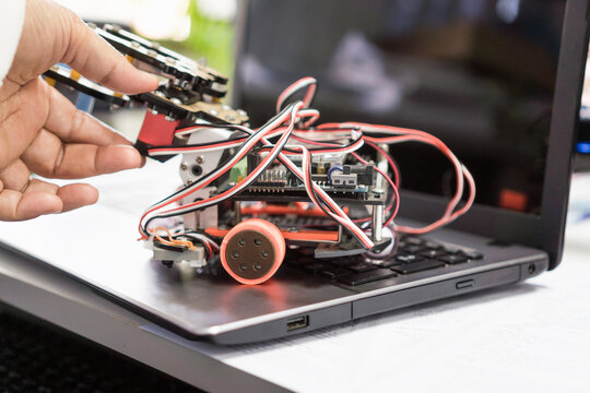 Learning STEM Education robotics project concept: Asian Student group creating and studying for innovation robot model ipst that Study generation for DIY electronic Kit in 21st education classroom