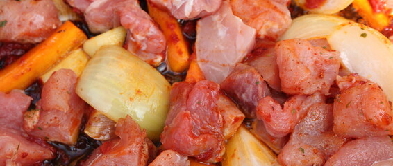 goulash with carrots and onions in a pan