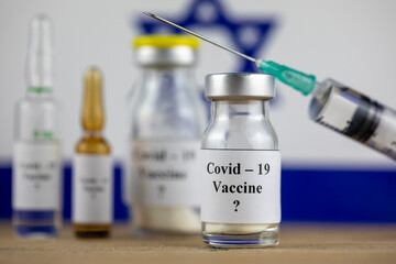 Israel Flag and bottle with vaccine and syringe, Coronavirus, Covid-19, Medicine, science and healthcare concept