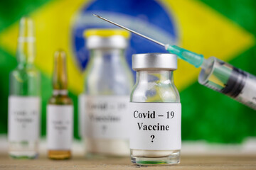Brazil Flag and bottle with vaccine and syringe, Coronavirus, Covid-19, Medicine, science and healthcare concept