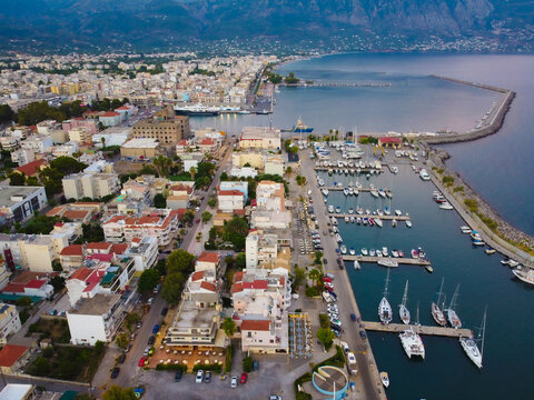 Aerial view of Kalamata marina with luxury yachts in line at dusk