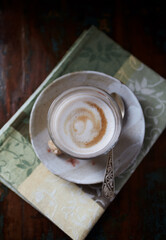Glass of Latte Macchiato. Dark background. Top view.	