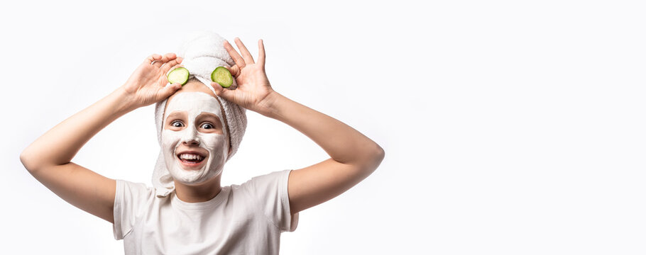Skin care. Beautiful girl with collagen mask and cucumber slices on eyes getting beauty tretment. concept of Spa treatments, Facials. Banner, copy space