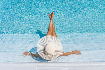 woman in luxury spa resort near the swimming pool. - 384493708
