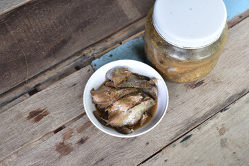 grilled fish on a wooden table