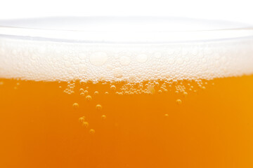 Mug of foamy beer isolated on white background.