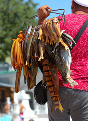 A man sells smoked fish