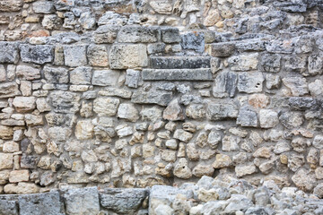 Stones in the wall of the house as an abstract background.
