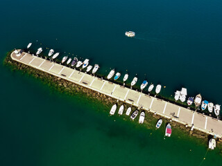 Fototapeta na wymiar Aerial view of Kalamata marina with fishing boats in line