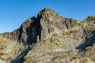 Ostry Szczyt (Ostry stit) - peak seen from the side of the Starolesna Valley (Velka Studena dolina). It is a frequent target for mountain climbers. - obrazy, fototapety, plakaty