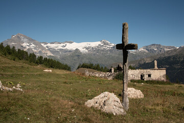 ruined chalet above Lanslebourg with the Dent Parrachee and the Vanoise glaciers in the distance