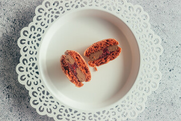 Macaroons. Delicious french desserts. Macaroons on the table. Macaroons with cherries