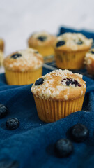 Close up crumbled blueberry muffin on a cloth