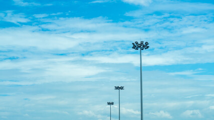 Large path lights with background sky.