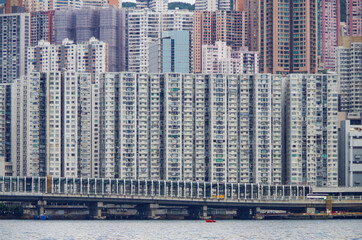 Boat and ship traffic in bay of Victoria Harbor Hong Kong, China with city skyline in background...