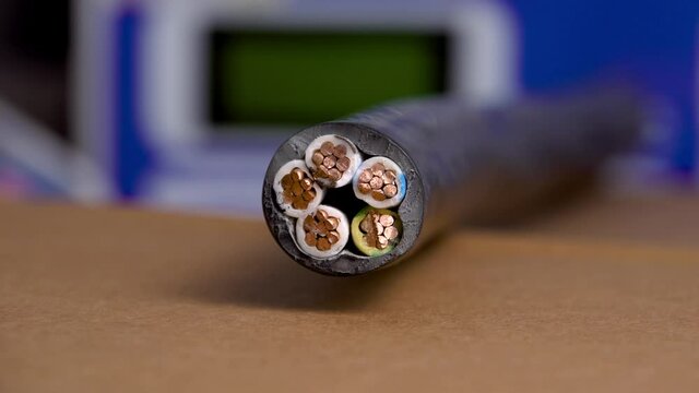 Cross-section of a high-voltage cable with a copper core in a plastic winding. Close up