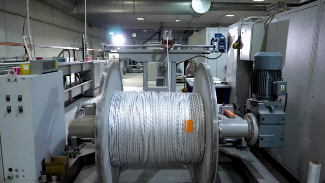an electrical cable in isolation is wound on a metal coil