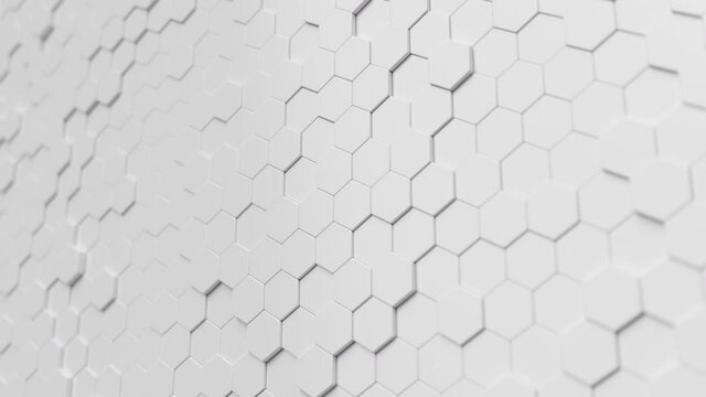 Animation movement of white hexagons with wave movements, honeycomb with offset effect. White abstract sci-fi background. Hexagonal wall moves in waves. Looping Seamless 3D Animation