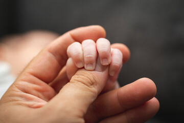 baby hand in a father's hand