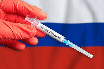 Obraz premium Coronavirus COVID-19 vaccination concept in Russian Federation with doctor hand and syringe