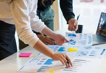 Businessman in casual wear is preparing marketing report material for strategy analysis and business planning.