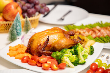 Roasted  chicken  with sauce and grilled autumn vegetables: corn  on wooden table, top view, frame. Christmas or Thanksgiving Day or christmas ,new year  food concept.