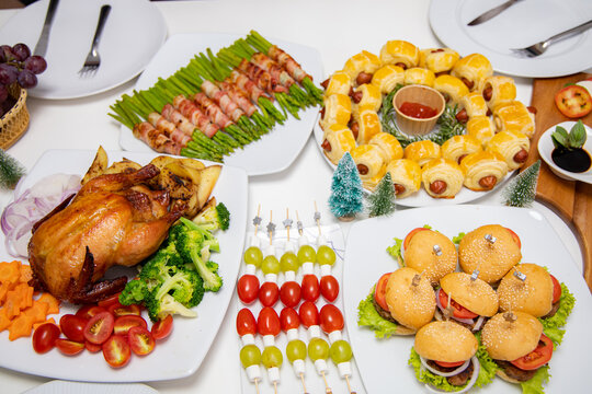 Roasted chicken with sauce and grilled autumn vegetables: corn on wooden table, top view, frame. Christmas or Thanksgiving Day or christmas ,new year food concept. - Powered by Adobe