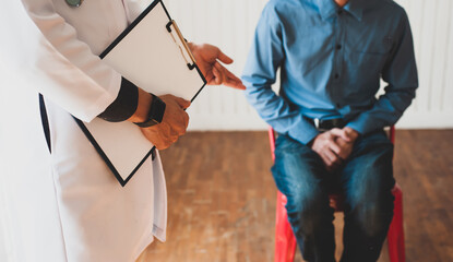 Doctors hold documents to check the health and diagnose male patients. Male health problem concept.