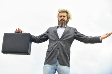 Business concept. bag with money. happy and successful man hold money case. bearded man show office...