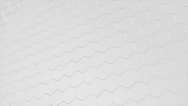 Movement of a wall of hexagons in waves up and down, which creates red self-luminous hexagons. Abstract futuristic geometric surface of hexagons. Hexagonal pattern. Looping, Seamless 3D Animation