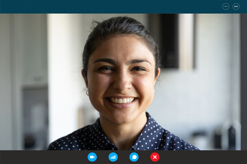 Close up screen view portrait of happy Indian woman speak talk on video call. Smiling millennial...