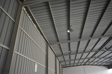 Industrial warehouse construction and interior and outdoor view of the roof ceiling structure. 