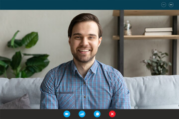 Close up screen view headshot portrait of smiling man have webcam conference at home office. Happy...