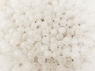 Top view of many white balls in ball pool.