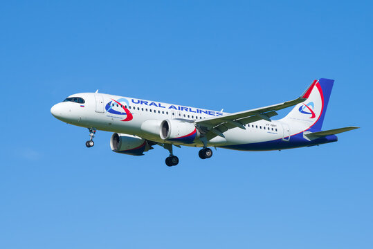 SAINT-PETERSBURG, RUSSIA - AUGUST 08, 2020: Airplane AIRBUS A320neo (VP-BRY) of the airline "URAL AIRLINES" close up in the blue cloudless sky