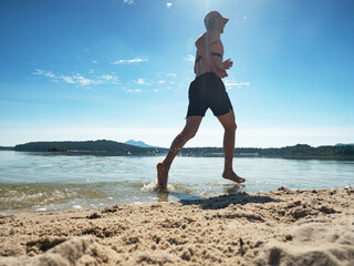 Run in water at beach, water drops refreshing body