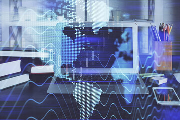 Financial chart drawing and table with computer on background. Double exposure. Concept of international markets.