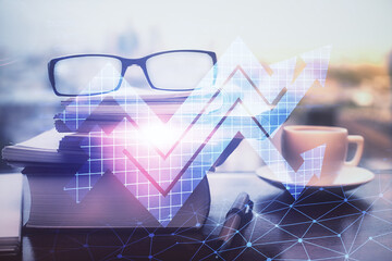 Arrows drawing up with glasses on the table background. Concept of business growth. Double exposure.