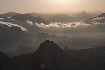 Amazing and cloudy sunrise in the mountains. Cloudscape in Spain.