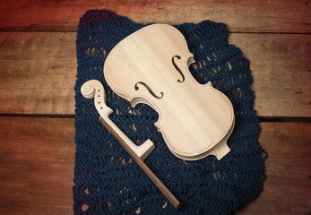 Raw violin  put on wooden timber board