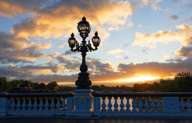 Fototapeta na wymiar Beautiful sunset view seen from Alexandre III bridge in Paris, France