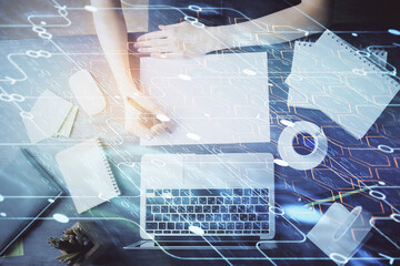 Multi exposure of writing hands on background with data solution hologram. Technology concept.